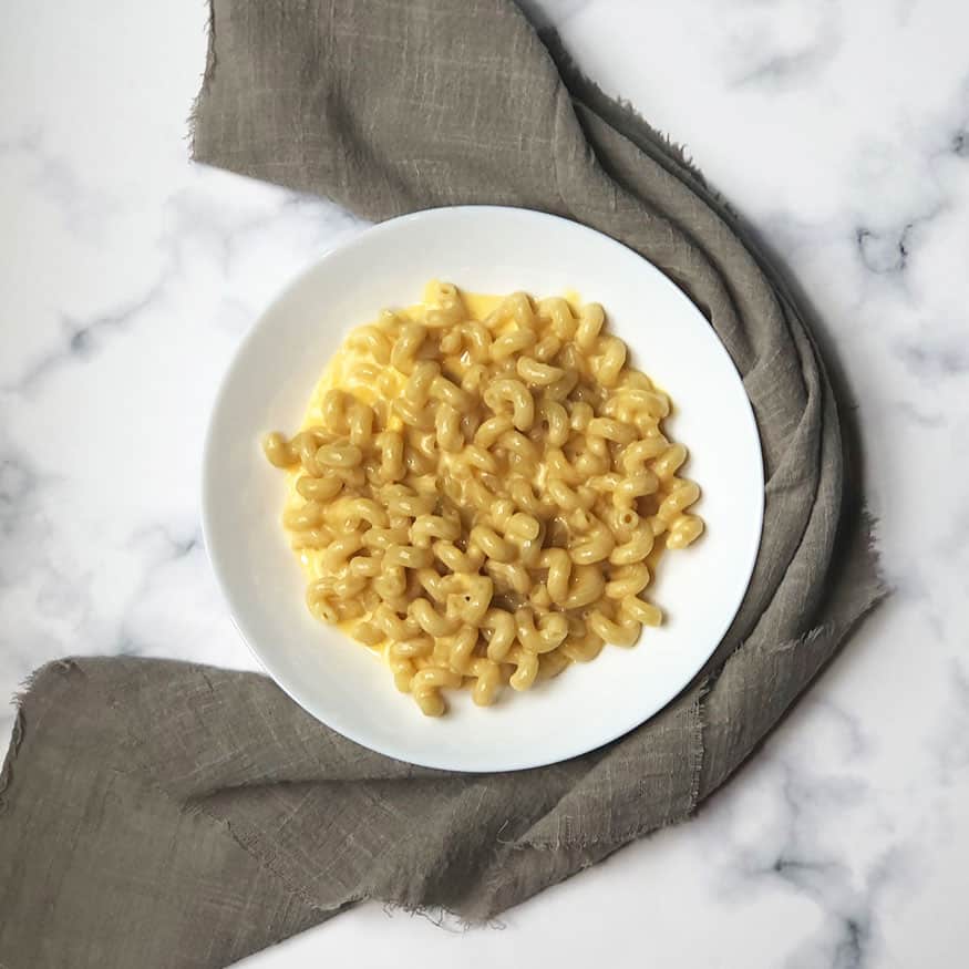 Copycat Outback Mac and Cheese (Mac A Roo & Cheese) in a white bowl  with a gray linen. 