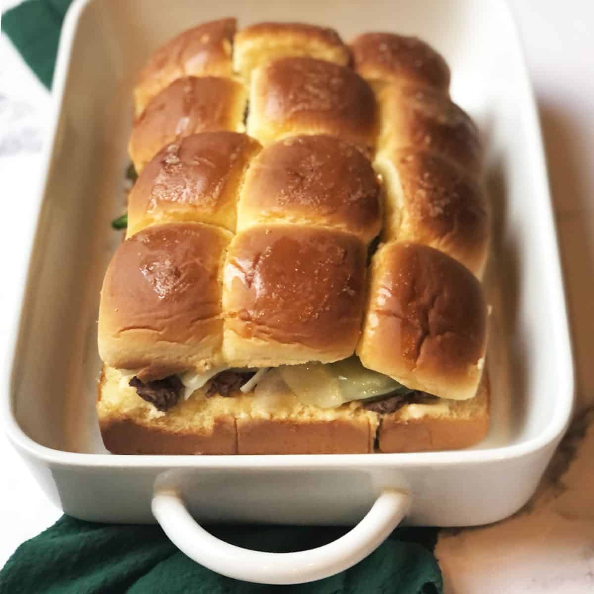 Philly Cheesesteak Sliders with Ground Beef in a casserole dish