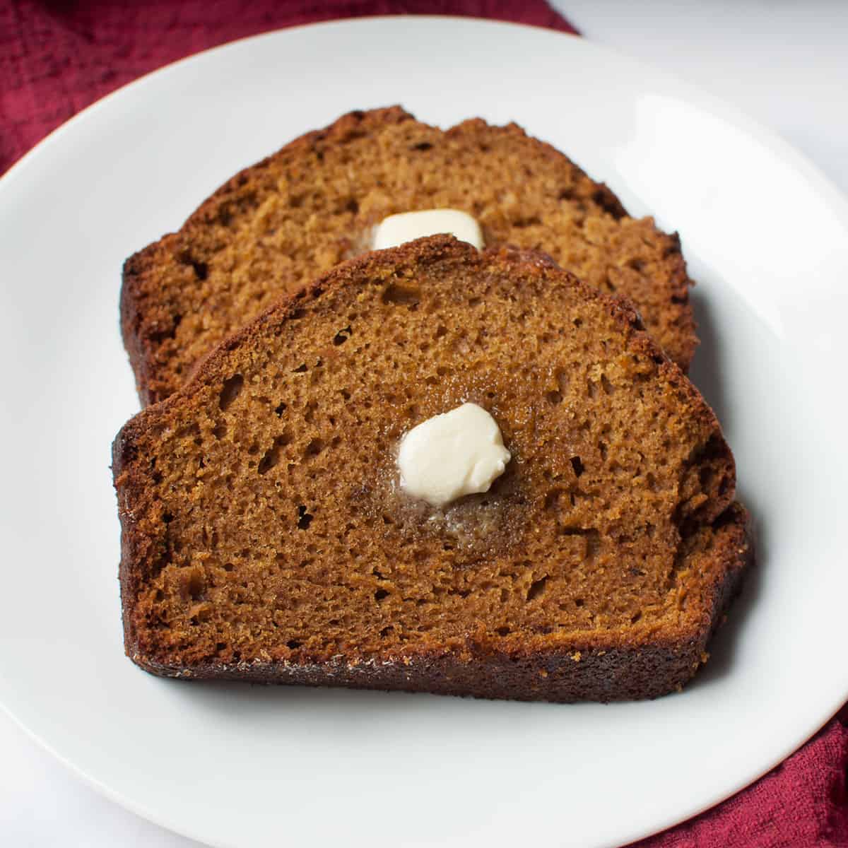 pumpkin bread slices with butter on them